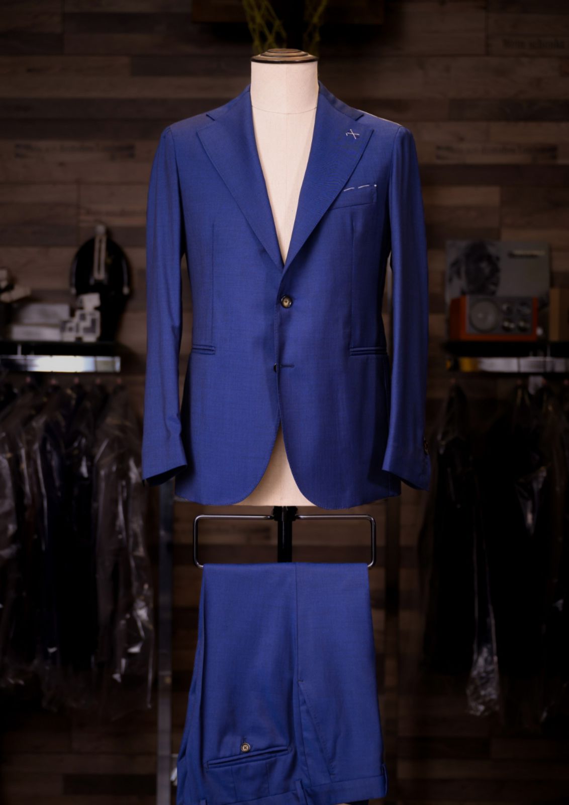 Cobalt blue single-breasted Carelli suit on a tailor's mannequin